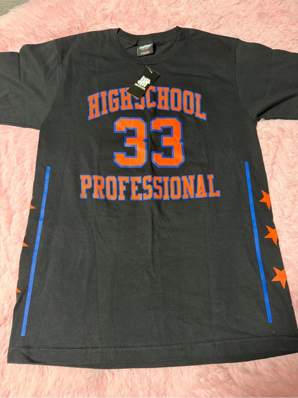 Undefeated Black Tee with Orange and Blue 'Highschool Professional 33' Graphic